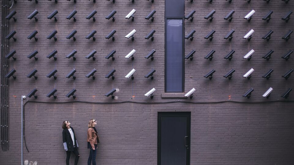 CCTV cameras attached to a wall. Lots of them