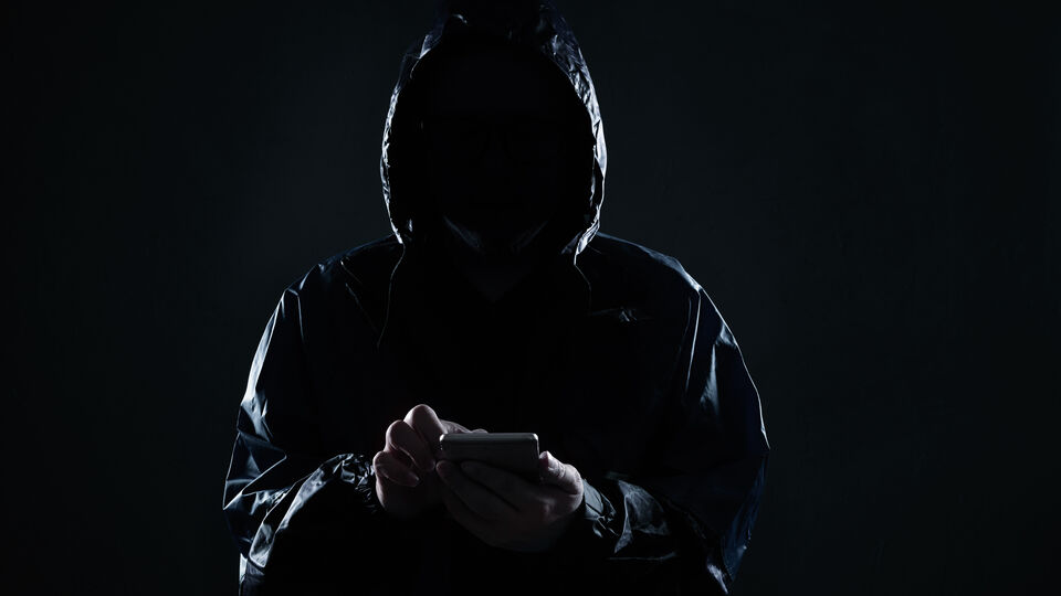 Hidden figure accesses a phone