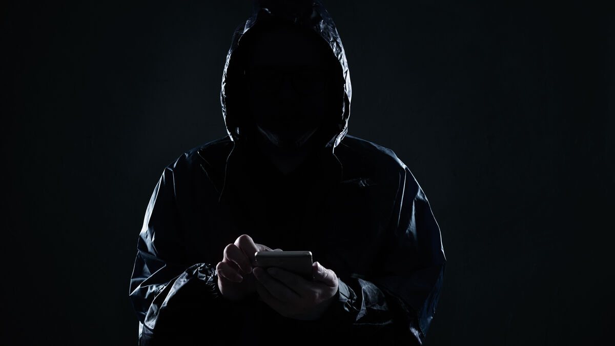 Hidden figure accesses a phone