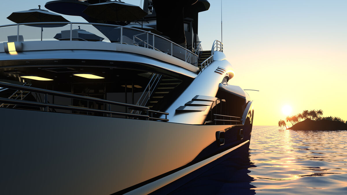 A superyacht in the sea, near to a tropical island