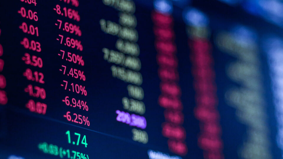 Stock market figures on a screen