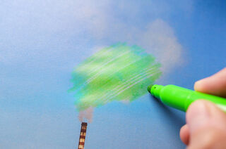 Green marker drawing over chimney smoke