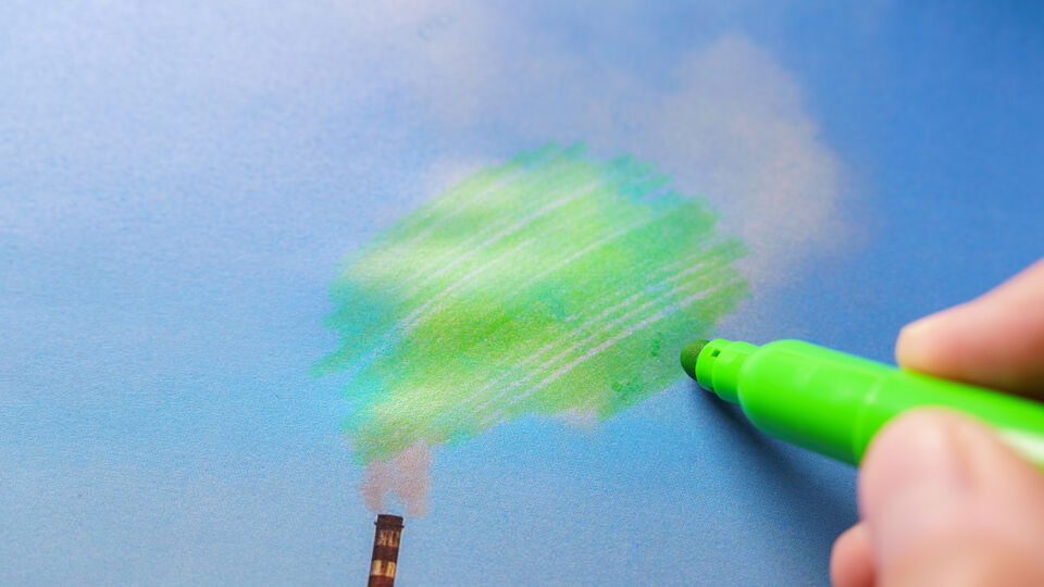 Green marker drawing over chimney smoke
